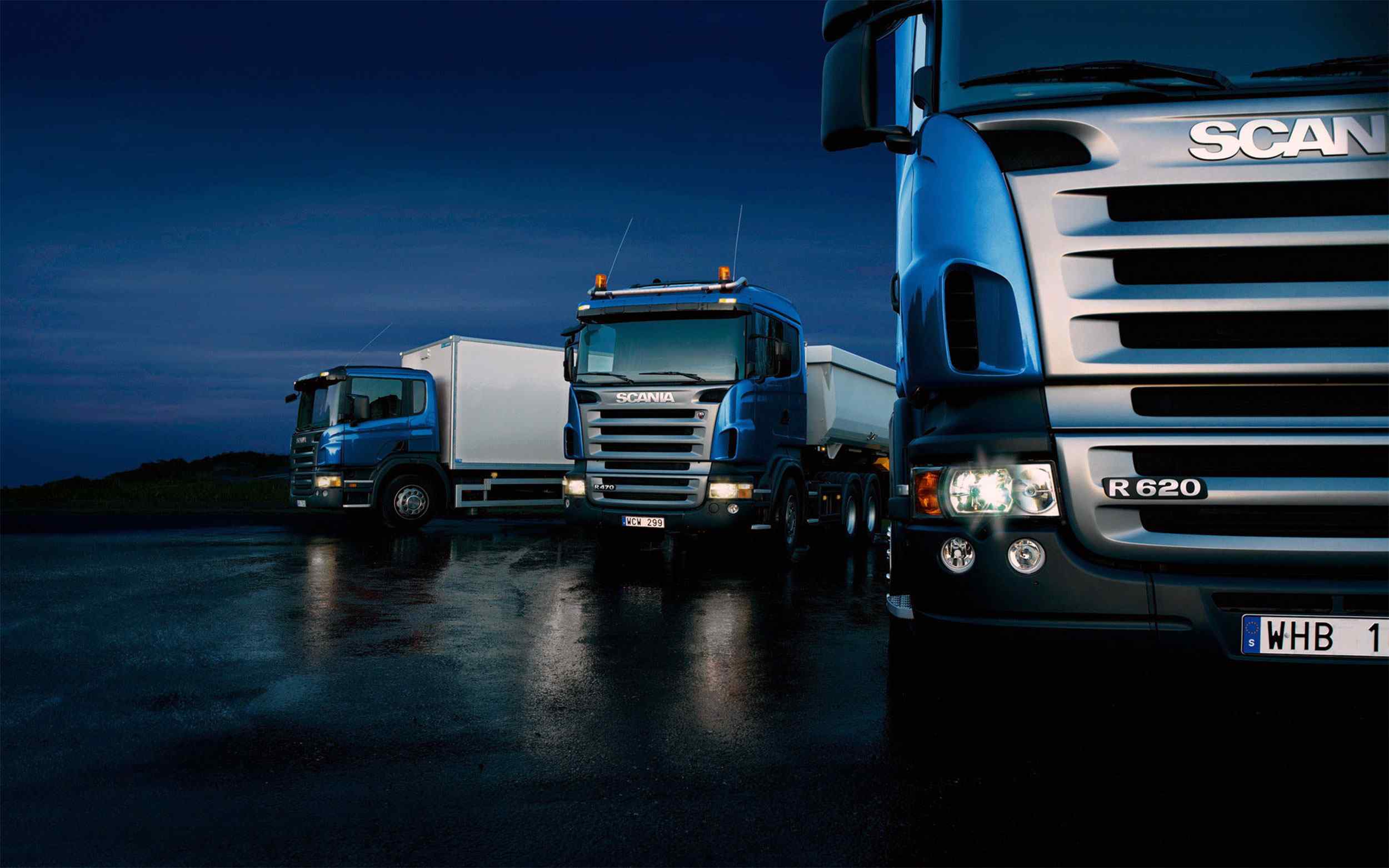 Three-trucks-on-blue-background.jpg